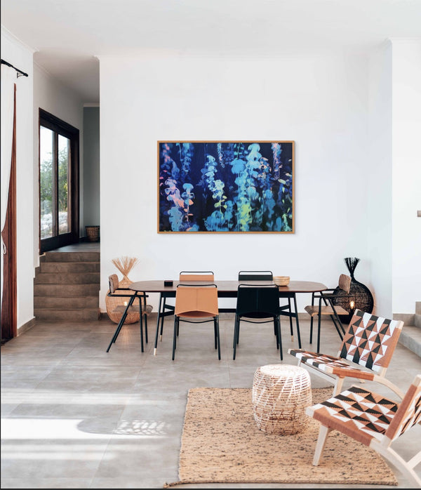 This blue botanical print is exactly what our open space needed! Ties the dining and living areas together perfectly